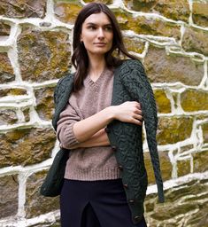 Our made in Ireland fisherman knit cardigan in forest green is lightly heathered and so cozy. We love to wear ours with denim and a button down cotton shirt , or over the floral Emma dress with leather boots. This cardigan runs true to size like the cream cardigan, and does not have an oversized fit like the grey cardigan. 100% Merino Wool. Made in Ireland. Black Silk Dress, Forest Green Color, Wellington Boot, Cream Cardigan, Grey Cardigan, The Cream, Dark Denim, Forest Green, Knit Cardigan