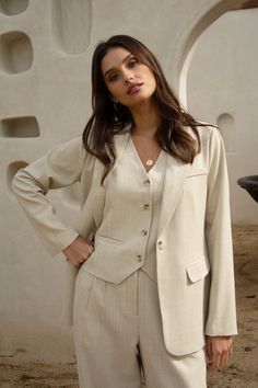 This mélange beige blazer stands out as a warm-weather take on classic tailored style. It's got a single-button closure, plus timeless details for a polished finish. •Padded shoulders •Notched lapels •Chest pocket •Two hip pockets •Single-button closure Item Number: 24957 Beige Blazer Outfits Women, Blazer Outfits Women, Beige Jumpsuit, Tailored Style, Fashionable Work Outfit, Blazer Outfits For Women, Beige Blazer, Blazer Beige, Single Button Blazer