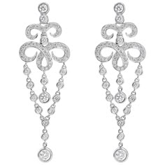 This fashionable pair of fringe dangle earrings showcases an open-work filigree design, encrusted with round diamonds, accented by suspending diamonds by the yard chain. Diamonds weigh 1.85 carats total.Made in 18K White Gold. Style available in different price ranges. Prices are based on your selection. Please contact us for more information. Luxury Intricate Design Drop Chandelier Earrings, Luxury Drop Chandelier Earrings With Intricate Design, Luxury Intricate Design Chandelier Drop Earrings, Elegant Diamond Dangle Earrings With Intricate Design, Classic Filigree Dangle Chandelier Earrings, Classic Filigree Chandelier Earrings, Classic Filigree Chandelier Dangle Earrings, Luxury Pierced Dangle Chandelier Earrings, White Gold Pierced Chandelier Drop Earrings