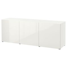 a white cabinet with three doors and two drawers on the front, against a white background