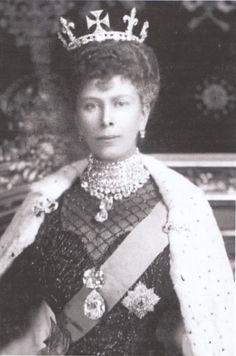 an old black and white photo of a woman wearing a tiara