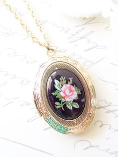 "A gorgeous gold plated photo locket adorned with a lovely vintage black glass limoges with pink rose dangles so pretty from a 16k gold plated link chain with lobster clasp. Locket has a lovely floral etched pattern Total length of chain measures 18\" Locket measures 23x30mm Cameo measures 18x13mm Locket is high quality and nickel free Matching earrings available in my shop as shown in photo 5 Your purchase will come beautifully wrapped ready for gift giving" Vintage Rose Necklace For Wedding, Vintage Pink Jewelry For Keepsake, Vintage Pink Keepsake Jewelry, Vintage Rose Necklace For Gift, Vintage Rose-colored Jewelry For Gifts, Vintage Rose Color Necklace For Gift, Rose Vintage Necklace For Gift, Vintage Rose Design Necklace For Gift, Vintage Rose Design Jewelry In Rose Color