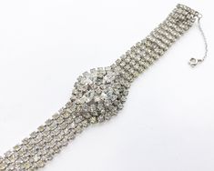 "~ 1950s beautiful & elegant rhinestone bracelet ~ Dimensional oval center ~ Chain guard ~ Silver metal ~ Brighter than photo shows! ~ Excellent Measures- 7.2\" x 1.25\" (18.41 x 3.17 cm) Band width- .50\" (1.27 cm) Additional Vintage Jewelry in our sister shop Glenna's Jewels: http://glennasjewels.etsy.com More Incredible Vintage: http://glennasvintageshop.etsy.com Instagram @glennas_clothing Facebook https://www.facebook.com/glennasclothing" Vintage Oval Rhinestone Jewelry, 1950’s Dress, Rhinestone Bracelet, Green Enamel, Rhinestone Necklace, Vintage Rhinestone, Cuff Bracelet, Clip On Earrings, Diamond Bracelet