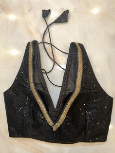 Alluring black sequin saree blouse with sequin lace. Buy designer blouse in USA from Pure Elegance. Disclaimer: The actual product may vary slightly from the image. These are custom orders, hence expect slight variation in color, placement of the motif or buta. ESTIMATED DELIVERYBecause this is a custom order, it would take about 4 weeks from the date of purchase. RETURN POLICY: This product is a custom order and cannot be returned or exchanged. Party Pre-draped Saree With Padded Blouse For Festivals, Party Festivals Pre-draped Saree With Padded Blouse, Party Festive Pre-draped Saree With Padded Blouse, Bollywood Style Sequined Blouse Piece For Evening, Festival Party Pre-draped Saree With Padded Blouse, Anarkali Blouse Piece With Sequins For Navratri, Anarkali Sequined Blouse Piece For Navratri, Festival Saree With Padded Blouse For Party, Saree With Padded Blouse For Party And Festivals