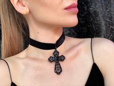 A beautiful black velvet choker featuring a Gothic black cross with a red rhinestone. In the back is an adjustable Velcro. With this accessory you can create a stylish Gothic look and complete your Halloween costume. 100% designed and handmade by our designers ( SETA Design studio in Kyiv). It will be securely packed in a box. Feel free to contact us if you have any questions. We accept return. Contact us within 3 days of delivery. Delivery of goods is returned within 7 days from the date of del