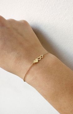 "14K Gold Triple Heart Bracelet, 9K Solid gold bracelet, Dainty gold bracelet, Love bracelet, Gift for her, Hearts bracelet, Rose Gold bracelet, 9K Gold bracelet, Delicate gold bracelet, FREE EXPRESS SHIPPING Beautiful and delicate bracelet with a triple heart charm made in 14K or 9K solid gold. \"One is loved because one is loved. No reason is needed for loving.\" -- Paulo Coelho Whisper...Love is in the air! -------------------------------------------------- D E T A I L S 14K Solid Gold or 9K Delicate Gold Bracelets For Valentine's Day, Delicate Gold Bracelet For Valentine's Day, Delicate Yellow Gold Heart Bracelet For Anniversary, Gold Delicate Name Bracelet For Anniversary, Delicate Gold Name Bracelet For Anniversary, Delicate Gold Heart Bracelet For Anniversary, Yellow Gold Heart Bracelet For Anniversary On Mother's Day, Double Heart Yellow Gold Bracelet For Anniversary, Yellow Gold Name Bracelet For Anniversary On Valentine's Day