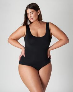 This bodysuit is a dream come true! Its perfect for all body types, won't dig into your skin, and keeps you dry. Plus it has patented technology that helps protect against everyday leaks-periods, urine or sweat. It absorbs up to 9ml of liquid so it's perfect for daily use or light days during your period. And the black lined gusset provides superior stain protection in every colourway - what more could you ask for?! A sleeveless plus size top to transform your workwear and everyday outfits Viita Black Seamless Full Coverage Bodysuit, Supportive Seamless Shapewear Bodysuit, Supportive Full Coverage Bodysuit With Lined Body, Supportive Full Coverage Smoothing Bodysuit, Supportive Full Coverage Solid Bodysuit, Black Second-skin Bodysuit With Built-in Bra, Black Second-skin Leotard With Scoop Neck, Black Scoop Neck Second-skin Leotard, Sleek Black Scoop Neck Bodysuit