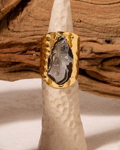 Close up of a Black Geode Cigar Ring on a Ring Stand with a Branch in the Background Unique Gold Agate Ring, Unique Agate Crystal Ring Gift, Unique Agate Crystal Ring For Gift, Agate Open Ring Gift, Agate Open Ring For Gift, Artisan Agate Ring As Gift, One Of A Kind Agate Ring As A Gift, Artisan Agate Ring Gift, Agate Rings As A Gift