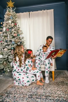 Pajama set comes with long sleeve button-up top and pair of pants Holiday tree print with red trim lends sweet, seasonal charm Ultra soft fabric provides cozy all-night comfort Perfect for family Holiday pictures by the tree, or relaxing movie nights in Gift your family's wardrobe a seasonally sweet vibe with these Festive Winter Trees Family Pajama Sets. These pajama sets come with a button-up long sleeve top and pair of matching bottoms. Both pieces are made from a soft fabric blend for comfortable wear, with an elastic waistband on the pants that allows for a flexible yet stay-put fit. This set makes it so the whole family can suit up in coordinating style this holiday season. Pajama Christmas Pictures Family, Matching Family Pajamas Christmas, Mommy And Me Christmas Pajamas, Pajama Family Photo Shoot, Family Pj Christmas Pictures, Christmas Pj Photoshoot Family, Family Christmas Pictures Pajamas, Family Pajamas Christmas Photo Ideas, Family Christmas Pajamas Photoshoot