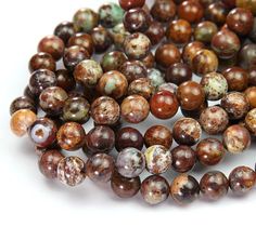 the beads are brown and white with speckles on them