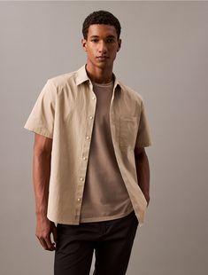 Crafted from a cotton polyester blend, this button-down shirt has a crisp, weightless feel. Styled with short sleeves and a point collar. Cut in a classic fit and made with stretch for effortless wear.  Material: 51% Cotton, 45% Polyamide, 4% Elastane. Button Downs, Calvin Klein, Button Down Shirt, Cotton Blend, Short Sleeves, Fashion Week, Top Outfits, Mens Outfits, Fashion Outfits