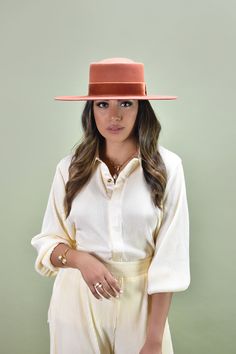 With all the flair of a classic boater hat, this handcrafted piece makes a striking presentation with a new dipped crown style. It's fashioned in smooth 100% pure Australian wool, and embellished with an elegant velvet bow. Designed with an adjustable inner band to customize and adjust to the perfect fit! Be sure to check out all our unique hat and beret styles! Details: 100% Australian wool Spot / specialist clean Style & Fit: Brim: 8.5 cm Head circumference: Small/Medium - 57cm, Medium/Lar Elegant Flat Brim Boater Hat For Fall, Elegant Fall Boater Hat With Brim, Elegant Fall Brimmed Boater Hat, Elegant Fitted Boater Hat With Flat Crown, Elegant Felt Hat With Flat Crown For Spring, Chic Flat Brim Top Hat For Fall, Spring Formal Fedora With Flat Crown, Elegant Spring Felt Hat With Flat Crown, Chic Fall Top Hat With Flat Brim