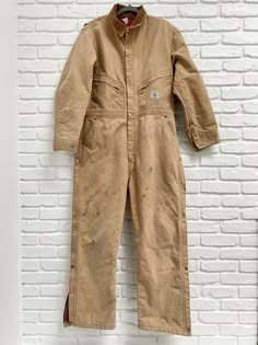 Vintage 1989 100 Years Carhartt Jumpsuit Large red lined excellent 80’s Snap and zipper Leg. Size 44R Coveralls. Zipper pockets. This has been freshly washed and dried. Any blemishes you see have remained after washing, but these things are supposed to get worn anyway. A very cool piece of Carhartt history! PROUDLY USA MADE!!! Vintage Carhartt Women, Carhartt Jumpsuit, Carhartt Vintage, Painters Overalls, Grease Costume, Carhartt Women, Men Carhartt, Vintage Wrangler, Boiler Suit