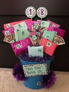 a bucket filled with lots of candy and some kind of numbers on top of it