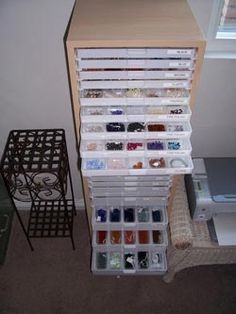 the drawers are filled with different types of beads