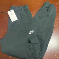 Nike Womens Black Sportswear Essentials Mid Rise Loose Fit Cargo Pants Size S Xl Brand: Nike Department: Women Size: S, Xl Color: Black Type: Pants Style: Cargo Pattern: Solid Theme: Sports Occasion: Activewear Season: All Season Features: Elastic Waist, Pockets Condition: New With Tags I Offer Discounts For All Return Customers. - Jvs Nike Cotton Sweats With Pockets, Nike Cotton Joggers With Pockets, Sporty Tracksuit With Pockets For Loungewear, Nike Athleisure Cargo Pants With Cargo Pockets, Nike Cargo Pants With Cargo Pockets Athleisure Style, Nike Cargo Pants With Side Pockets For Sports, Nike Sporty Bottoms With Cargo Pockets, Nike Sporty Activewear With Side Pockets, Nike Sporty Cargo Pants With Pockets