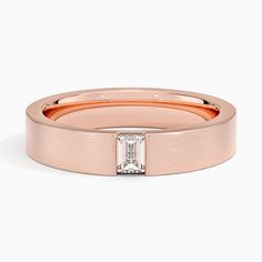 a rose gold ring with a baguette cut diamond