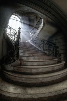 an image of a staircase with light coming through the window