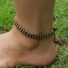 Hand Made Fair Trade Anklet Double Strand Brass Beads Festival Anklets With Adjustable Length, Festival Adjustable Anklets, Handmade Bohemian Gold Anklets, Handmade Adjustable Toe Ring Anklets, Adjustable Metal Anklets For Festivals, Adjustable Metal Traditional Anklets, Traditional Adjustable Metal Anklets, Adjustable Brass Beaded Bracelets With Gold Beads, Adjustable Metal Anklets Nickel Free