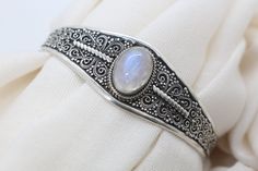 Moonstone Bracelet for Women - Handmade Filigree 925 Sterling Silver moonstone cuff bracelet - Moonstone Jewelry Cuff bracelets for women. Detailed Workmanship. *Material: 925 Sterling Silver Handmade *Design: Filigree and oxidized cuff bracelet *Item Weight: 20 to 25 gram *Stone : Natural Moonstone *Style: Cuff More moonstone cuff bracelets. https://nepalsilverjewelery.etsy.com/listing/1410648525 All our jewelry comes with a beautiful handmade pouch. Ready to ship in just 6-10 business days. Elegant Moonstone Jewelry For Festivals, Bohemian Gemstone Wedding Bangle, Bohemian Gemstone Bracelets For Wedding, Bohemian Wedding Bracelets With Gemstones, Bohemian Wedding Gemstone Bracelets, Bohemian Moonstone Bracelet, Silver Bohemian Moonstone Bracelets, Bohemian Silver Moonstone Bracelets, Elegant Moonstone Cuff Bangle Bracelet