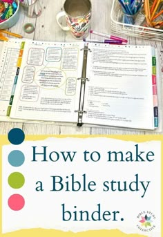 the bible study binder is open on a table with pens, pencils and markers