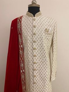 This Wedding sherwani come in a wide variety of colors, embellishment, and outlook. Usually these designer wedding sherwanis are very lavish with the combination of vibrant hues, heavy embroidery with credible detailing like zari, zardozi, sequins, thread work & dori work and the outfit is complimented with bottom.The fabrics used is silk material. Make your occasion significant by our striking ensemble which brings out the astonishing charm in you. Includes- sherwani with bottom Colour options Raw Silk Straight Kurta Sherwani For Traditional Ceremonies, Raw Silk Sherwani For Traditional Ceremonies, Traditional Drape Raw Silk Sherwani For Ceremonies, Raw Silk Sherwani With Traditional Drape For Ceremonies, Bollywood Sherwani With Intricate Embroidery For Groom, Eid Sherwani With Dabka Work For Traditional Ceremonies, Groom's White Sherwani With Dabka Work, Long Raw Silk Sherwani With Dupatta, Festive Nehru Jacket With Intricate Embroidery For Groom