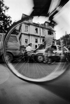 a person riding a bike on a city street