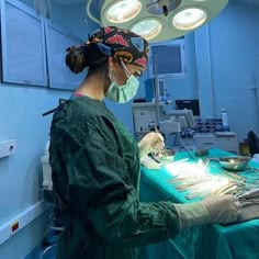 a woman is in the operating room with surgical equipment