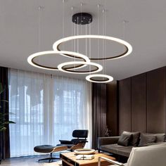 modern living room with round chandelier and chairs