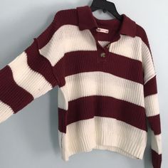 Size Juniors Large Knit Sweater. White And Cranberry Stripes. Collared Style With Three Buttons. Cropped Fit. This Is A Juniors Large But It Has An Oversized Fit So I Feel Like It Still Fits Like A Women’s Large. New With Tags! White Textured Knit Casual Polo Sweater, Casual White Textured Knit Polo Sweater, White Knit Polo Sweater, White Knitted Polo Sweater For Fall, White V-neck Knit Polo Sweater, White V-neck Polo Sweater For Fall, Winter White Polo Sweater, White V-neck Polo Sweater For Winter, Winter White Textured Knit Polo Sweater