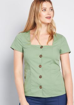 Design your space to be cozy and quaint so that your entering the scene in this short-sleeved blouse is the finishing touch ! A woven, cotton-blend top from our ModCloth namesake label, this green separate touts flattering tailoring, a square neckline, dark wood buttons decorating the front, and ties in the back. What a dream ! 75% Cotton, 21% Nylon, 4% Spandex. Hand wash. Front button closure. Imported Model is wearing size: 1X S Fabric provides stretch. S=24 inches Length 1X=28 inches Length | Vintage Style Swimwear, Casual Dresses Plus Size, Midi Dress Plus Size, Tunic Hoodie, Vintage Swimwear, Wood Buttons, Plus Size Outerwear, Casual Rompers, Square Neck Top