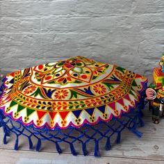 Indulge in luxury with our Handmade Indian Woolen Embroidery Pooja Thali Cover. Perfect for Pujas, weddings, and other special occasions, this multipurpose cover adds a touch of elegance to any event. Use it as a Prasad Thal, Puja Table Chowki, or simply as a beautiful decorative piece. Handcrafted with care, this cover is sure to impress. Package Information There are 3 variations (Pack Of 2 Red, Pack Of 2 Blue, Pack Of 4 2 Red & 2 Blue), you can select the one that best suits your needs. Material - Shining Silk Mix Fabric with woolen embroidery Generous Dimensions - These 17-inch diameter covers can be used in various ceremonial settings with a total dimension of 22 inches, these Thali covers provide ample coverage for a variety of uses. The spacious size ensures that your sacred items a Intricately Embroidered Fabric For Puja And Navratri, Intricate Embroidered Fabric For Puja And Navratri, Intricate Embroidery Fabric For Puja And Navratri, Intricate Embroidered Dupatta For Puja Festivals, Festival Dupatta With Intricate Embroidery For Puja, Embroidered Fabric For Puja And Festivals, Multicolor Embroidered Fabric For Navratri And Traditional Ceremonies, Traditional Embroidered Choli For Puja, Traditional Intricately Embroidered Choli For Puja