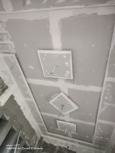 the ceiling is being painted with white paint