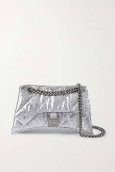 The gently curved silhouette of Balenciaga's 'Hourglass' bag is inspired by the house's '50s tailoring. Made from silver leather, this version is crinkled and quilted for softness and has an understated tonal strap that can be doubled up for a shorter drop. Luxury Quilted Party Bag, Heeled Rain Boots, Balenciaga Women, Quilted Shoulder Bag, High Heel Rain Boots, Metallic Bag, Balenciaga Bag, Backpack Tote Bag, Fashion Girl