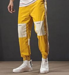 Sweat pants with patches on the knees. Drawstring. COLOR: mustard Yellow White Retro Pants For Streetwear, Retro Stretch Pants For Streetwear, Casual Cotton Color Block Pants, Streetwear Color Block Cotton Bottoms, Sporty Patchwork Pants For Streetwear, Casual Jogging Color Block Bottoms, Casual Color Block Jogging Bottoms, Color Block Cotton Bottoms For Streetwear, Sporty Cotton Color Block Sweatpants