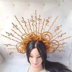 This wonderful medusa headpiece will make you the center of a Burning man festival or Halloween party. Your friends will appreciate this Snake goddess crown. Each part Gold halo crown is 100% hand made. Each detal is made by my hands with love for you. Hurry up and get this medusa cosplay head piece made exclusively for you. Crown spikes are made of wood. Spikes are neatly glued to the metal headband that I wore with tape. Spikes are painted with gold paint. Spikes are securely creased to the headband with felt. The medusa head piece is decorated with fake snake, rhinestone and gold cord. The height of the spiked is about 8 inches (20 cm).  More of my halo crown you can see here https://www.etsy.com/ru/shop/byIraFomina?ref=hdr_shop_menu&section_id=26561099 Address to me on any question. I Fantasy Headpieces For Cosplay Events And Parties, Fantasy Headpiece With Structured Crown For Costume Party, Fantasy Headpieces For Cosplay Party Events, Fantasy Crown With Pinched Shape For Costume Party, Fantasy Structured Crown Headpiece For Costume Party, Fantasy Costume Hat With Pinched Crown For Costume Party, Fantasy High Crown Costume Hats For Cosplay, Fantasy Halloween Costume Hats With Structured Crown, Halloween Festival Costume Hats And Headpieces With Structured Crown