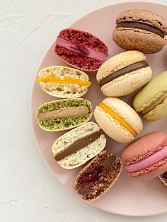 there are many different types of macaroons on the plate