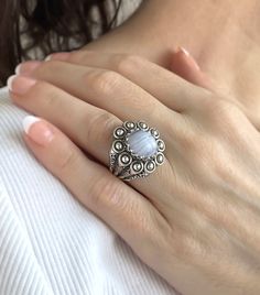 This is a beautiful filigree art designer handcrafted ring made with 925 sterling silver and a natural blue lace agate gemstone. The blue stone is a 10x12 mm cabochon oval cut. The ring face length is 0.9 inches / 22.50 mm and width is 0.80 inches / 20.00 mm. The ring is oxidized and highly polished and the ring face length is 0.9 inches / 22.50 mm and width is 0.80 inches / 20.00 mm. It comes with a velvet pouch, silver polish cloth and a luxurious gift box, making it the perfect option for any Handmade Silver Chalcedony Moonstone Ring, Elegant Moonstone Ring Ideal For Gifting, Handmade Agate Moonstone Ring Gift, Elegant Blue Moonstone Ring Stamped 925, Silver Rings For Women Unique, Ring Design For Women, Gemstone Ring Design, Embroidery Ring, Rings For Women Unique