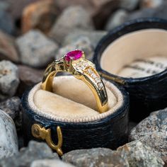 This charming ring is centered with one (1) marquise cut ruby set into a four-prong setting. The shoulders of the ring are each accented with six (6), prong set, round brilliant cut diamonds. The ring measures 6.6mm at the top, rises 4.7mm above the finger, tapering to 2.4mm wide and 1.1mm thick at the base of the shank. This ring is currently a size 6.75. Luxury Marquise Ruby Ring With Diamonds, Luxury Ruby Marquise Cut Rings, Marquise Ruby Ring With Diamonds, Marquise Cut Ruby Diamond Ring With Prong Setting, Classic Marquise Ruby Ring With Vvs Clarity, Luxury Yellow Gold Ruby Ring With Marquise Cut, Luxury Marquise Cut Yellow Gold Ruby Ring, Luxury Ruby Ring Marquise Cut For Formal Events, Luxury Marquise Cut Ruby Ring In Yellow Gold