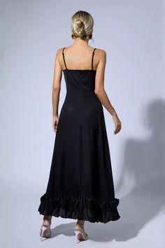 Get ready to turn heads in the stunning Izabella Black A-line Maxi Dress! Crafted from premium, comfortable fabric, this dress is designed to accentuate your curves and hug your body in all the right places. The A-line skirt adds elegance, and the strappy dress adds just the right amount of flirtatiousness. In classic understated black, all you need is pumps and statement earrings for a chic look.  Dress Length: Approx 130cm Materials: Viscose Fiber Gentle Dry Clean Only  Model is 5 ft 7 and wea Silver Sequin Top, Glitter Wedding Dress, A Line Maxi Dress, Bandage Midi Dress, Strappy Dress, Floral Shirt Dress, Puff Sleeve Dresses, Strappy Dresses, Maxi Knit Dress