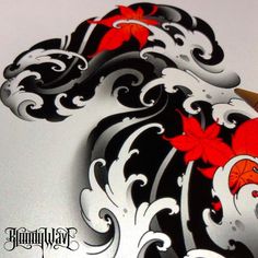 a computer mouse with red and white designs on it