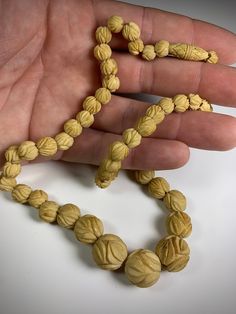 Gorgeous bohemian beaded necklace. Beads are hand carved from bone in a rosette design. Nicely patinated & in fantastic condition. Could use a cleaning but I typically prefer the aged look. Wonderful addition to any antique jewelry collection. Feel free to message me anytime prior to purchase. I'm a happy to chat. Please take a moment to look through some of my other listing for similar items you may also enjoy. Thank you! 🙏 Artisan Carved Necklace For Collectors, Artisan Carved Necklace Collectible, Bohemian Carved Necklace In Natural Color, Traditional Natural Color Hand-strung Necklace, Traditional Carved Beaded Necklaces For Jewelry Making, Traditional Carved Adjustable Beaded Necklaces, Traditional Adjustable Carved Beaded Necklace, Traditional Adjustable Carved Beaded Necklaces, Vintage Carved Round Necklaces