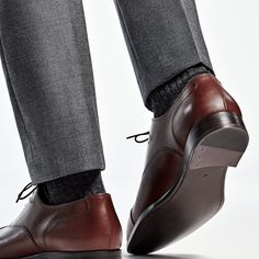 These classic brown Oxfords are crafted from supple calf leather in a flexible Blake stitch, and feature full leather lining and sole. Brown Goodyear Welted Cap Toe Leather Shoes, Semi-formal Calf Leather Dress Shoes With Round Toe, Timeless Brown Oxfords For Business Casual, Leather Cap Toe Oxfords For Fall, Classic Brown Almond Toe Oxfords, Classic Brown Oxfords With Leather Sole, Classic Brown Oxfords With Rubber Sole, Classic Oxfords With Calf Leather And Leather Sole, Timeless Brown Oxfords With Leather Lining