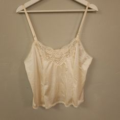 New Without Tags. I Bought This New With Tags Originally, Removed Them, And Then It Sat In My Closet Ever Since & Now It Doesn't Fit I Love This Cami For So Many Reasons! One Is I Was A Big Madonna Fan When I Was A Child, I Love Lace Everything. Ivory Nylon Satin Body With Floral Lace Trim V-Neck, Smaller Scale Lace Trim On Hem And The Back, Adjustable Straps, Soft Material. Intended To Be A Slip, Can Be Worn As Undershirt, Night Shirt Or Just As A Regular Top As I Meant To. Looks Great Tucked I Beige Camisole Top For Daywear, Vintage Cami Top For Daywear, Cream Lace Trim Camisole Tank Top, Vintage White Camisole For Daywear, Vintage Spaghetti Strap Tops With Lace Trim, Vintage Lace Trim Top With Spaghetti Straps, Vintage Tops With Lace Trim And Spaghetti Straps, White Vintage Camisole For Daily Wear, Vintage White Camisole Top