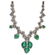 Delight in the splendor of this stunning necklace crafted from 18k white gold, a true testament to refined craftsmanship and elegance. This enchanting piece of jewelry embraces a collection of exquisite treasures, housing a total of 7 resplendent emeralds and 25 brilliant-cut diamonds that vary in size. The diamonds, ranging from 0.05 to 0.10 carats, create a symphony of brilliance that dances upon the necklace's delicate chain. A remarkable feature of this masterpiece is its enchanting emeralds Luxury White Gold Emerald Necklace With Diamond Accents, Luxury White Emerald Necklace, Luxury Hand-set White Gold Emerald Necklace, Luxury Hallmarked Diamond Emerald Necklace, Luxury Diamond Emerald Necklace Hallmarked, White Gold Necklace, Necklace Craft, White Gold Necklaces, Delicate Chain