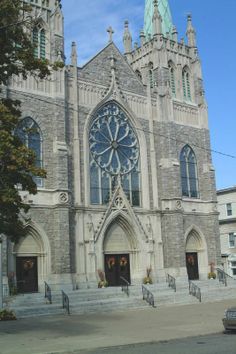 an old church with a large clock on the front