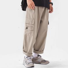 Experience timeless style and versatility with our Classic All-Match Straight-Leg Cargo Pants. Made with high-quality materials, these pants offer a comfortable fit and effortless elegance. With their straight-leg design and functional cargo pockets, they are perfect for any occasion. Elevate your wardrobe with this luxurious and essential piece. Features: -85% Cotton,15% Polyester -Mid-rise waist -Multi-Pockets -Regular Fit -Japanese style Leg Design, Effortless Elegance, Japanese Style, Timeless Style, Cargo Pants, Black Pants, Timeless Fashion, Mid Rise, Comfort Fit