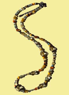 "Crystal beaded 30 inch necklace. Austrian crystal and Antique Czechoslovakian glass from our collection in shades of jonquil yellow, topaz and citrine. Many of the beads are rare and irreplaceable, originating from Czechoslovakia, Bavaria, Wattens, Kobe and Milano. Metal parts from our own tooling are antiqued bronze. \"Solaris\" is 30 inches long, handmade in the USA. Owen Glass Collection® jewelry is ready for gift giving, with an organza bag and description card included. Please let us know Spiritual Glass Beaded Necklaces With Oval Beads, Spiritual Oval Glass Beaded Necklaces, Spiritual Beaded Necklace With Oval Glass Beads, Spiritual Beaded Long Necklace, Bohemian Long Crystal Necklace With Polished Beads, Spiritual Glass Beaded Necklace With Polished Beads, Spiritual Glass Beaded Necklaces With Polished Beads, Unique Long Beaded Necklace With Faceted Beads, Bohemian Glass Crystal Necklaces For Jewelry Making