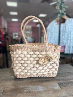 This stylish tote is the perfect accessory for your summer vacation! Its two-toned design and spacious interior give you loads of packing room without sacrificing on style. Pack your cares away in this chic and sassy bag! There is a permanent pouch on the side that allows you to keep everything in the bag secured and private. Width - 12Height - 9"Depth - 4.5"