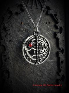 This Sigil of Asmoday necklace is an handmade pewter sculpture with a gem of your choice (my favorite is the red abalone, if you are looking for a very nice bloody red) This seal of Asmoday is one of the 72 Sigils of Goetia from Ars Goetia's Demonology This Sigil of Goetia pendant is sold with a free 18'' stainless steel chain, if you would like to have a different length for the chain, you can write the desired length in the private note section when ordering :) This Seal of Asmoday is a pendan Hand Cast Pewter Pendant Necklace, Collectible Red Medallion Jewelry, Red Symbolic Engraved Jewelry, Gothic Red Nickel-free Necklace, Red Gothic Necklace Nickel Free, Red Gothic Nickel-free Necklace, Symbolic Red Pendant Jewelry, Spiritual Red Metal Necklace, Red Spiritual Engraved Necklace